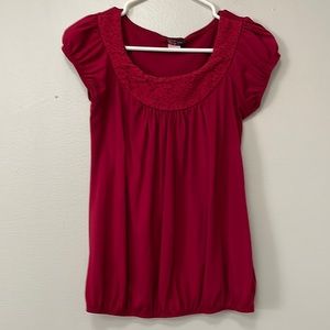 Red short sleeve shirt. Size medium